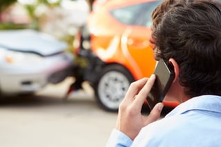 man calling car accident lawyer