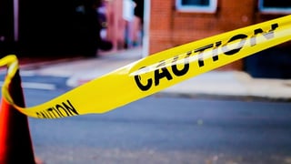 caution tape on city street