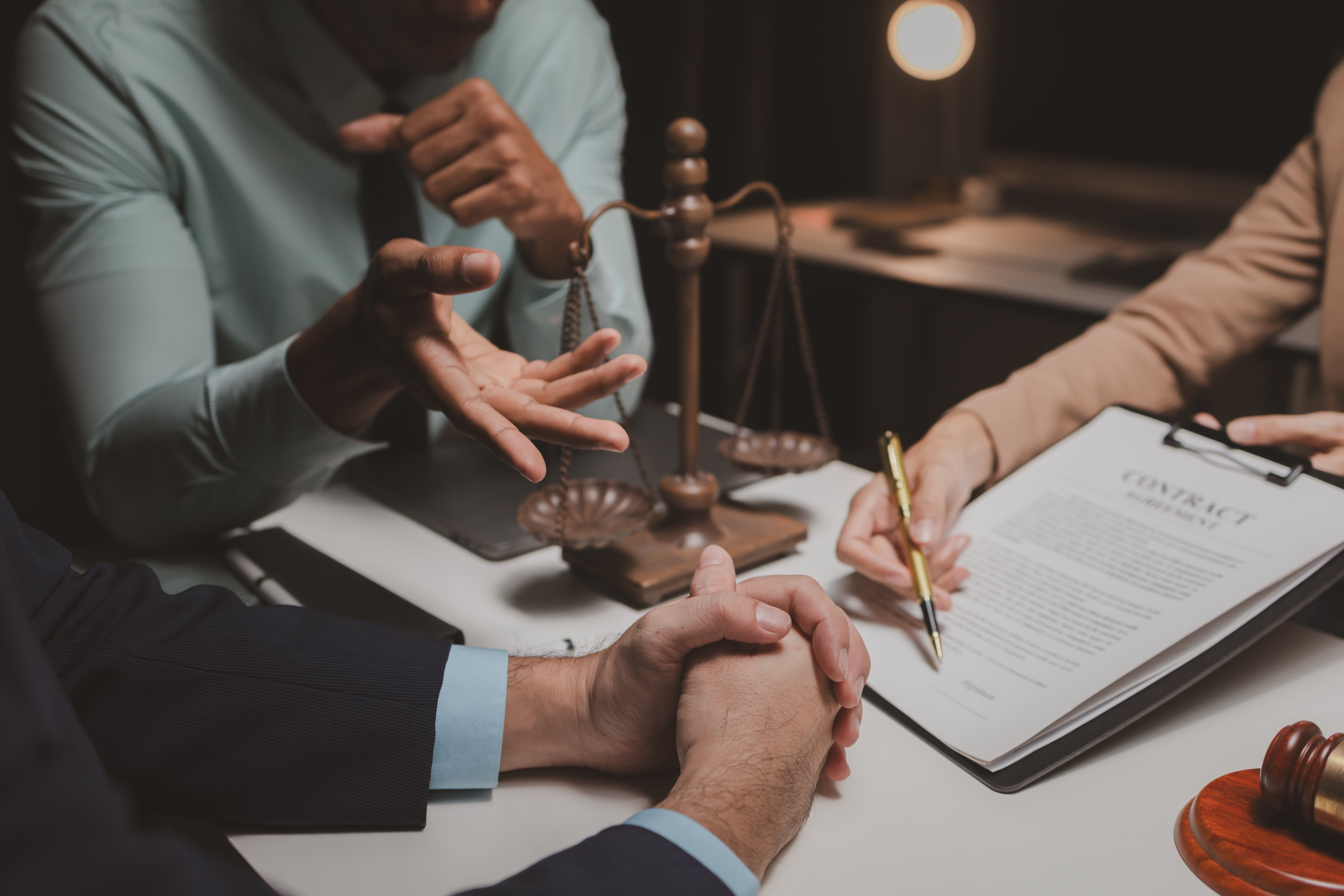a-group-of-lawyers-is-discussing-contract-document-2024-02-29-20-08-46-utc