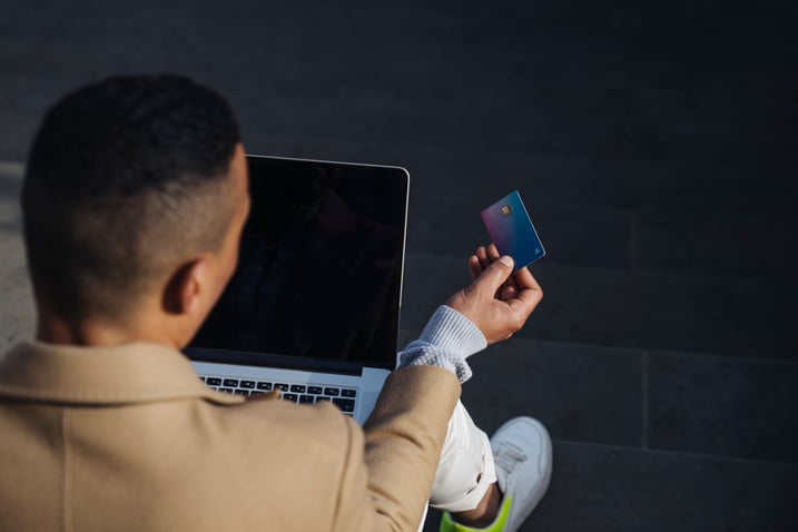 back-view-of-man-sitting-outdoors-with-laptop-doin-2022-03-08-01-03-35-utc