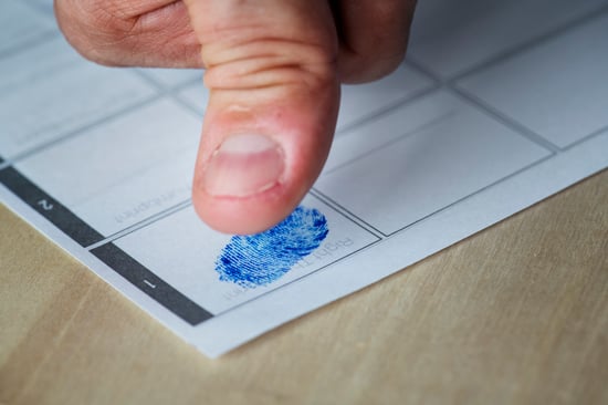 closeup-of-fingerprint-on-paper