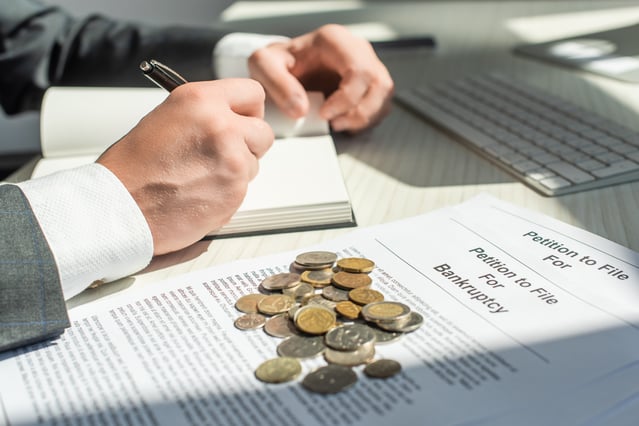 cropped-view-of-businessman-writing-in-notebook-ne-2023-11-27-05-31-04-utc