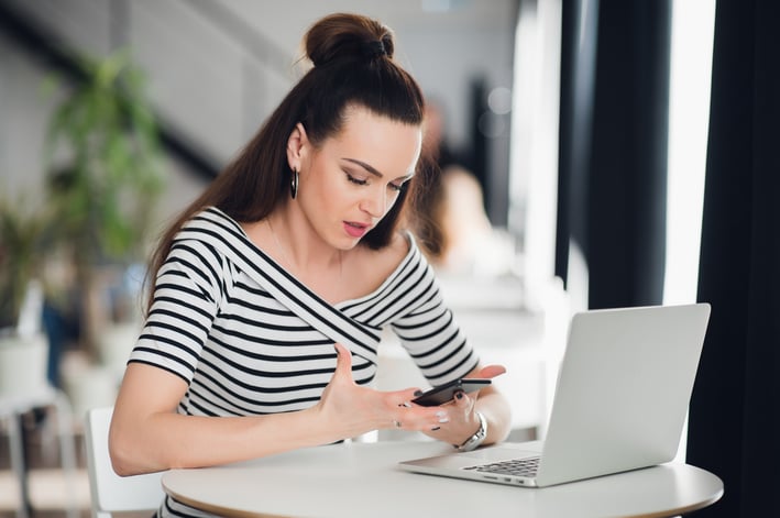 disappointed-businesswoman-looking-at-business-PFSMVNH