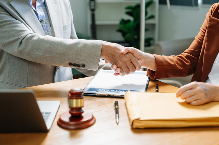 judge-and-client-shaking-hands-and-lawyers-discuss-2025-01-16-23-39-20-utc