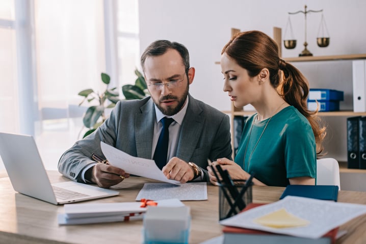 lawyer-and-client-discussing-contract-at-workplace-2024-11-01-00-33-41-utc