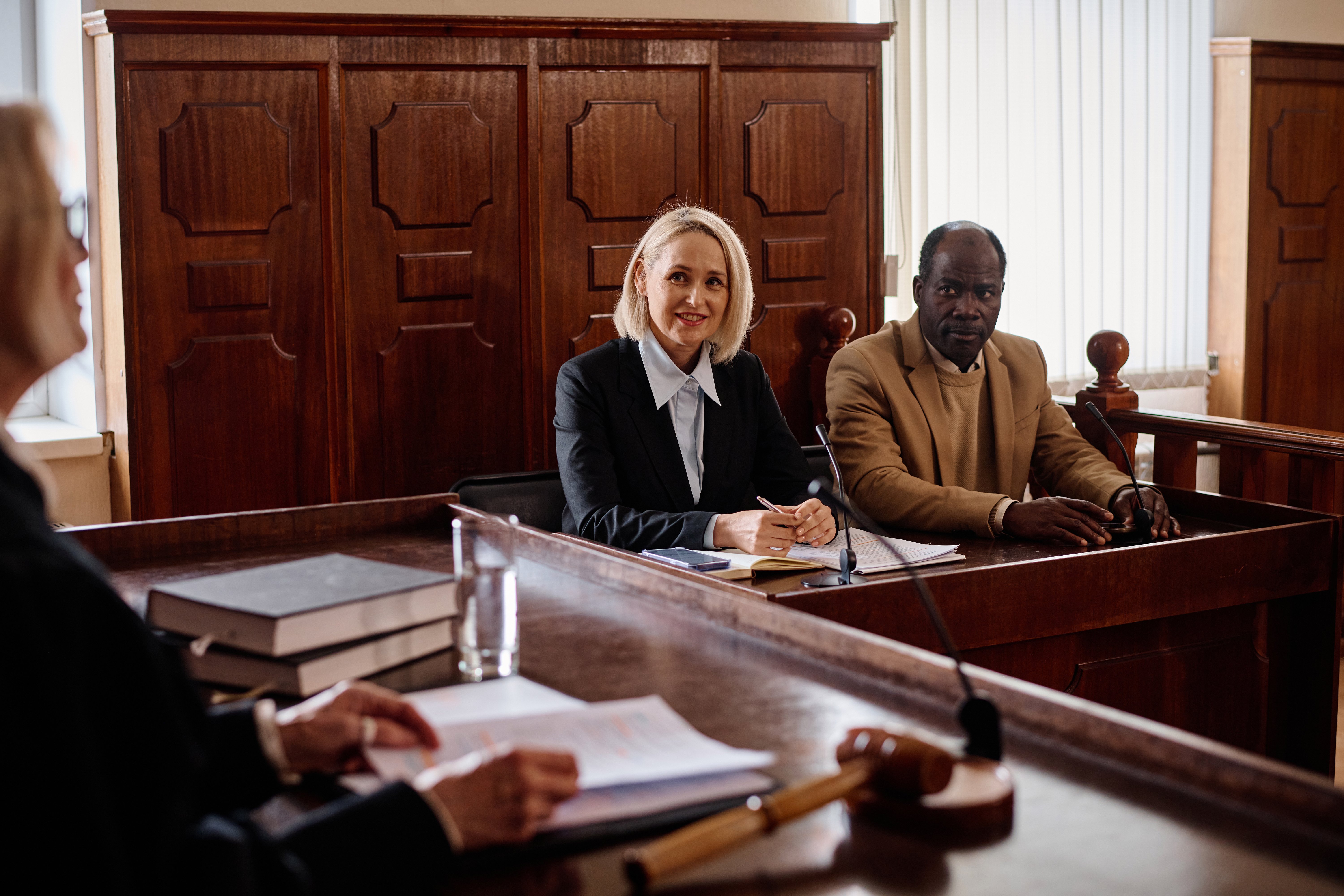 smiling-mature-female-attorney-and-her-african-ame-2023-11-27-05-10-13-utc