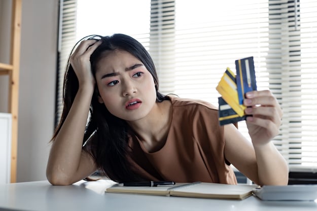 woman-is-stressed-and-overthink-by-debt-from-many-2022-02-08-00-00-52-utc