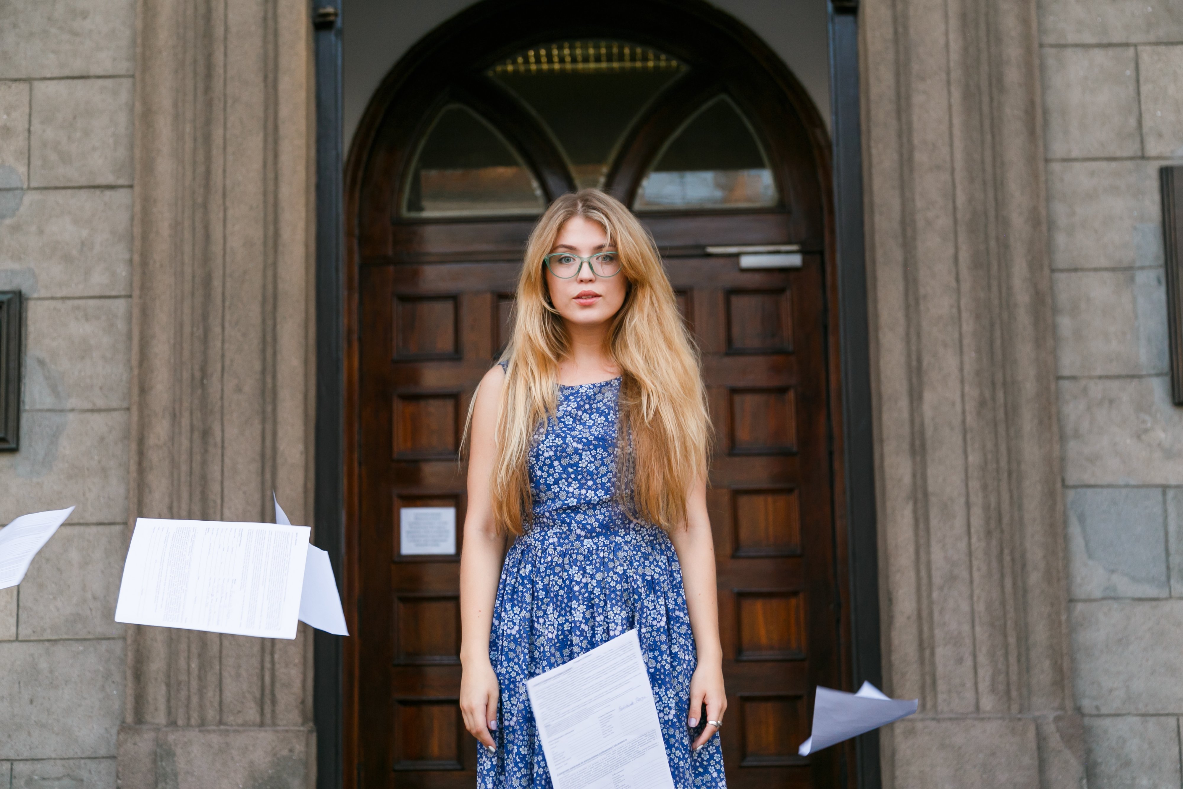 young-woman-threw-the-papers-in-casual-and-paper