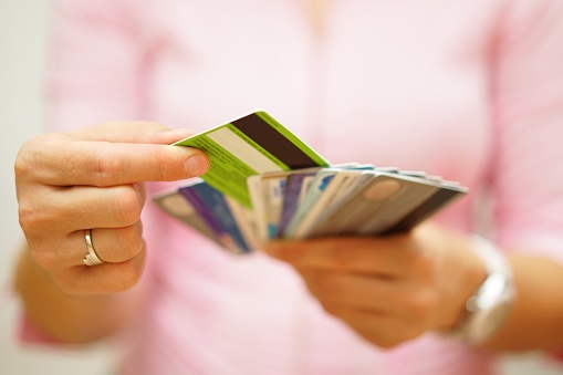 497840054_woman_holding_credit_cards.jpg