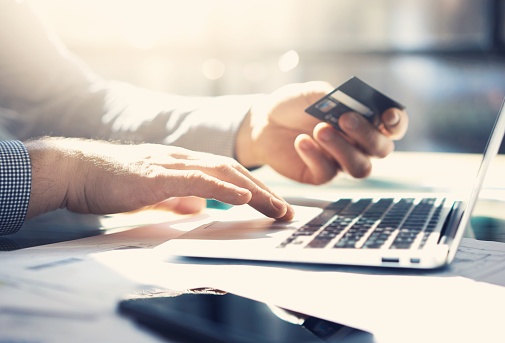 514568144_man purchasing with credit card.jpg