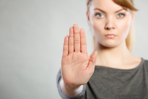 woman with stop hand motion