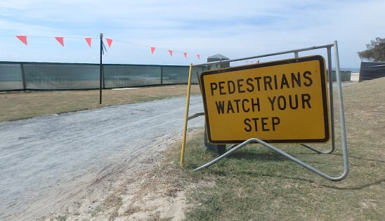 pedestrians watch your step sign - ThinkstockPhotos-619371196.jpg